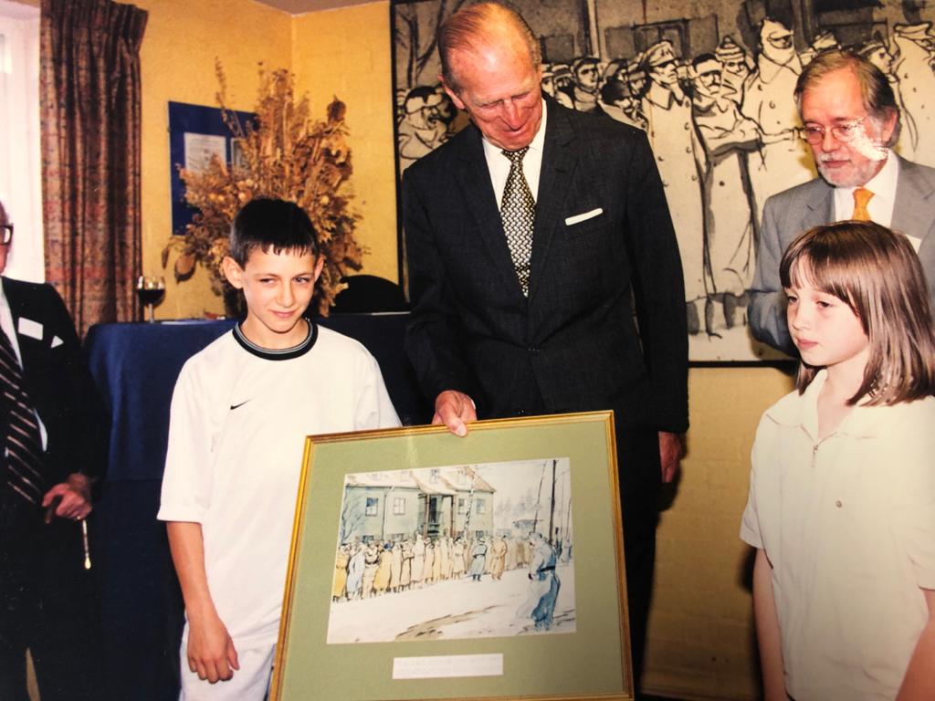 Prince Philip holding a copy of "Roll Call", May 2000